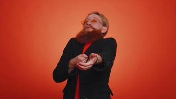 Mime young adult man pulling an imaginary unreal invisible rope showing how enduring, strong he is video