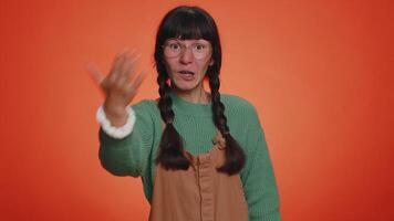 Woman showing inviting gesture with hands, ask to join, beckoning to coming, gesturing hello goodbye video