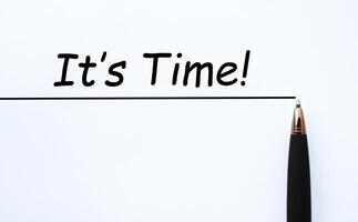 It is time text on white paper with straight line and pen background photo