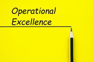 Operational Excellence text on yellow cover background with straight line and pencil background photo