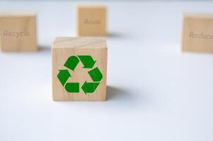 Focus on recycle symbol on wooden cubes with white background photo