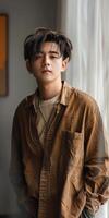 Young Man Leaning Against Window photo