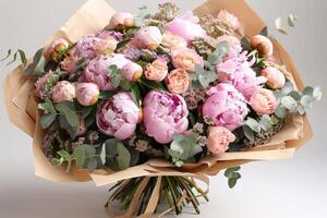 Pink Peony Bouquet Wrapped in Brown Paper photo