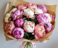 Pink and White Peony Bouquet on Table photo