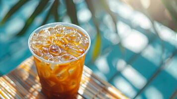 Cup of Iced Coffee on Wooden Table photo