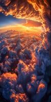 The Sun Sets Over Clouds Above Earth photo