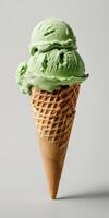 Scoop of Green Ice Cream in a Cone photo