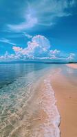 Sandy Beach With Clear Blue Water Under a Cloudy Sky photo