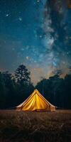 Yellow Tent in Field Under Night Sky photo