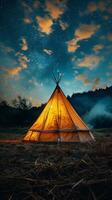 Tent in the Middle of a Field Under a Night Sky photo