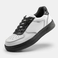 White and Black Shoe With Black Laces photo
