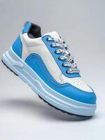 White and Blue Sneaker With Black Laces photo