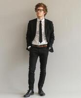 Businessman Standing in Front of Wall photo