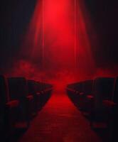 Red light shines in dark auditorium photo