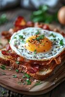 Bacon and egg sandwich on cutting board photo