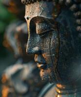 Close up of buddha statue in meditation pose photo
