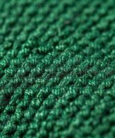 Close up of green knitted material photo