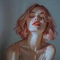 Woman with pink hair and orange lipstick photo