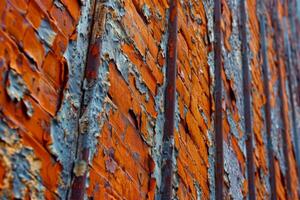 Close up of a brick wall with peeling paint photo