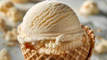 Scoop of Vanilla Ice Cream in a Waffle Cone photo