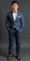 Dapper man in blue suit and bow tie photo