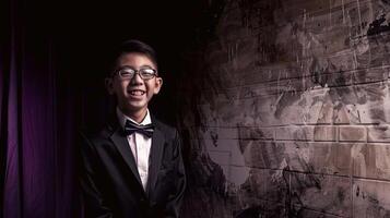 Man in tuxedo standing in front of brick wall photo