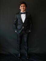 Stylish man poses in tuxedo photo