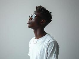 Man wearing sunglasses and white shirt photo