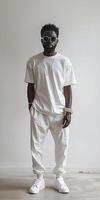 Man in white t-shirt and pants photo
