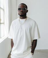 Man in white shirt and white pants photo