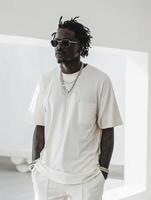 Man in white shirt and white pants photo