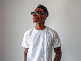 Man wearing sunglasses and white shirt photo
