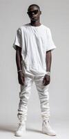 A man in a white shirt and white pants photo