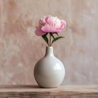 White vase with pink flower photo