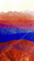 Majestic mountain range in blue and red photo