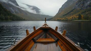 Boat in water with mountains in background photo