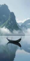 Boat floating on lake surrounded by mountains photo