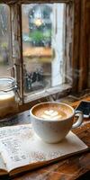 A cup of coffee on a wooden table photo