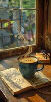 A cup of coffee on top of an open book photo