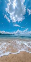 Sandy Beach Under a Blue Sky With Clouds photo