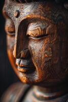 Close Up of a Wooden Statue of a Person photo