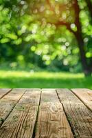 Empty Wooden Table Facing Green Park photo