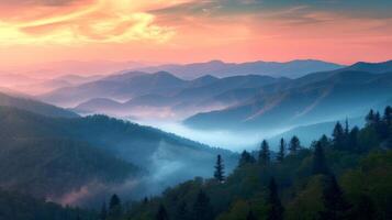Majestic Mountain Range Silhouetted by Sunset photo