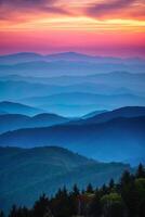 Majestic Mountain Range Silhouetted by Sunset photo