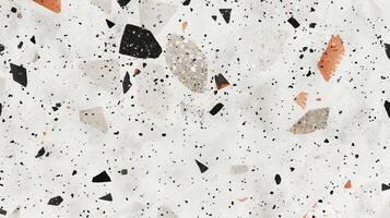 White Wall With Black, Orange, and White Speckles photo