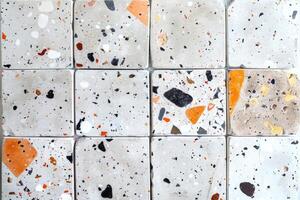 White Tile With Orange and Black Spots photo
