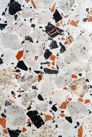 Close-Up of Orange and Black Marble Surface photo