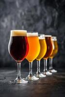 Assorted Beer Glasses on a Counter photo