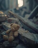 Brown Teddy Bear Sitting on Pile of Rubble photo