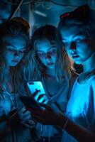 Group of Young People Looking at Cell Phone photo